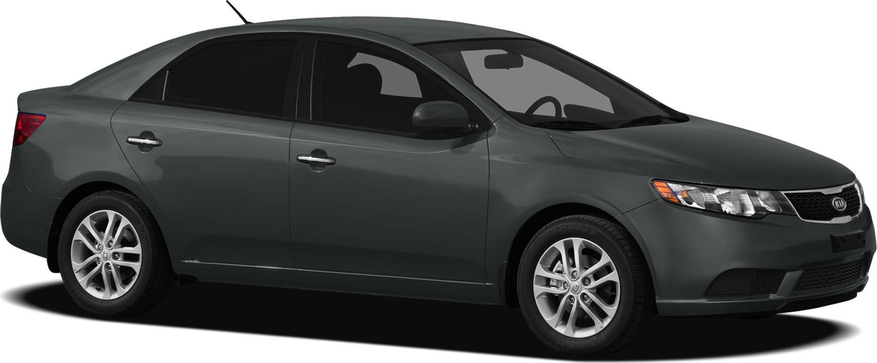 Four-door sedan side profile with alloy wheels and tinted windows.