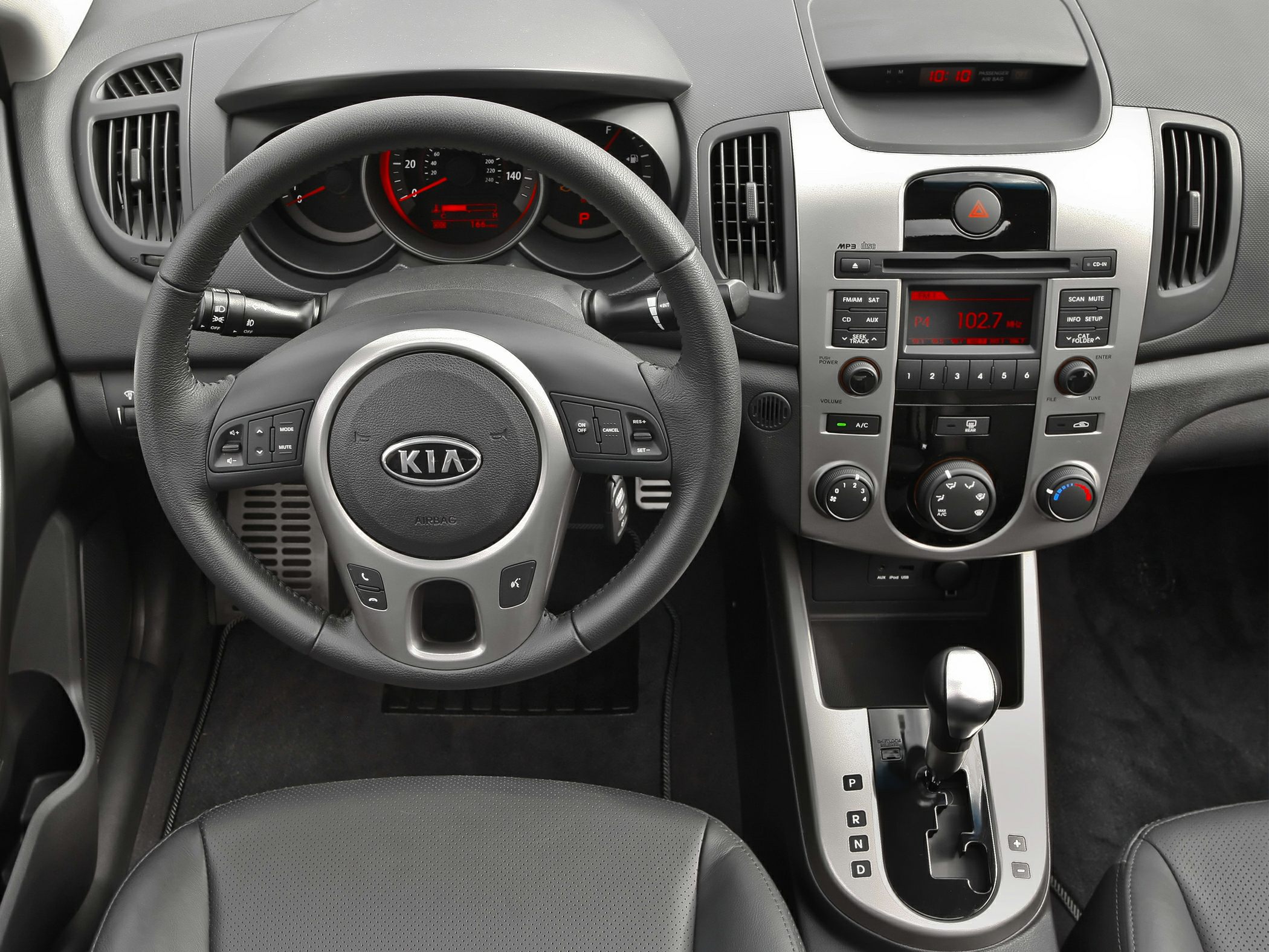 Steering wheel, dashboard, and center console with gear shift