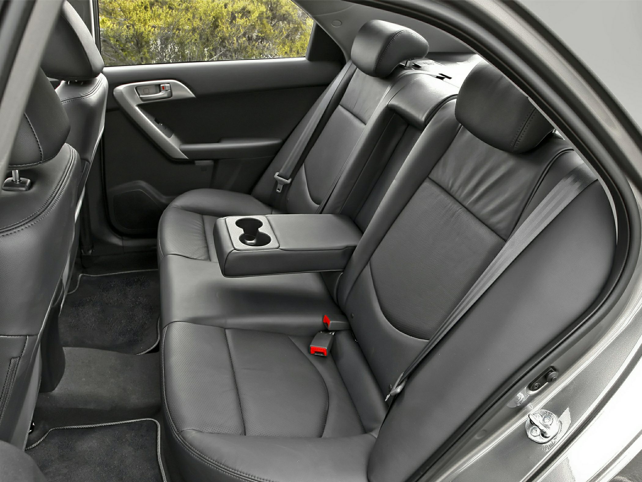 Black leather rear seats with center armrest and cupholders