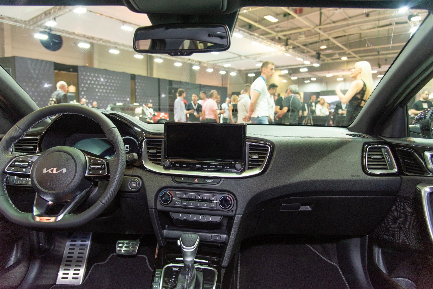 Interior dashboard and multifunction steering wheel with infotainment screen