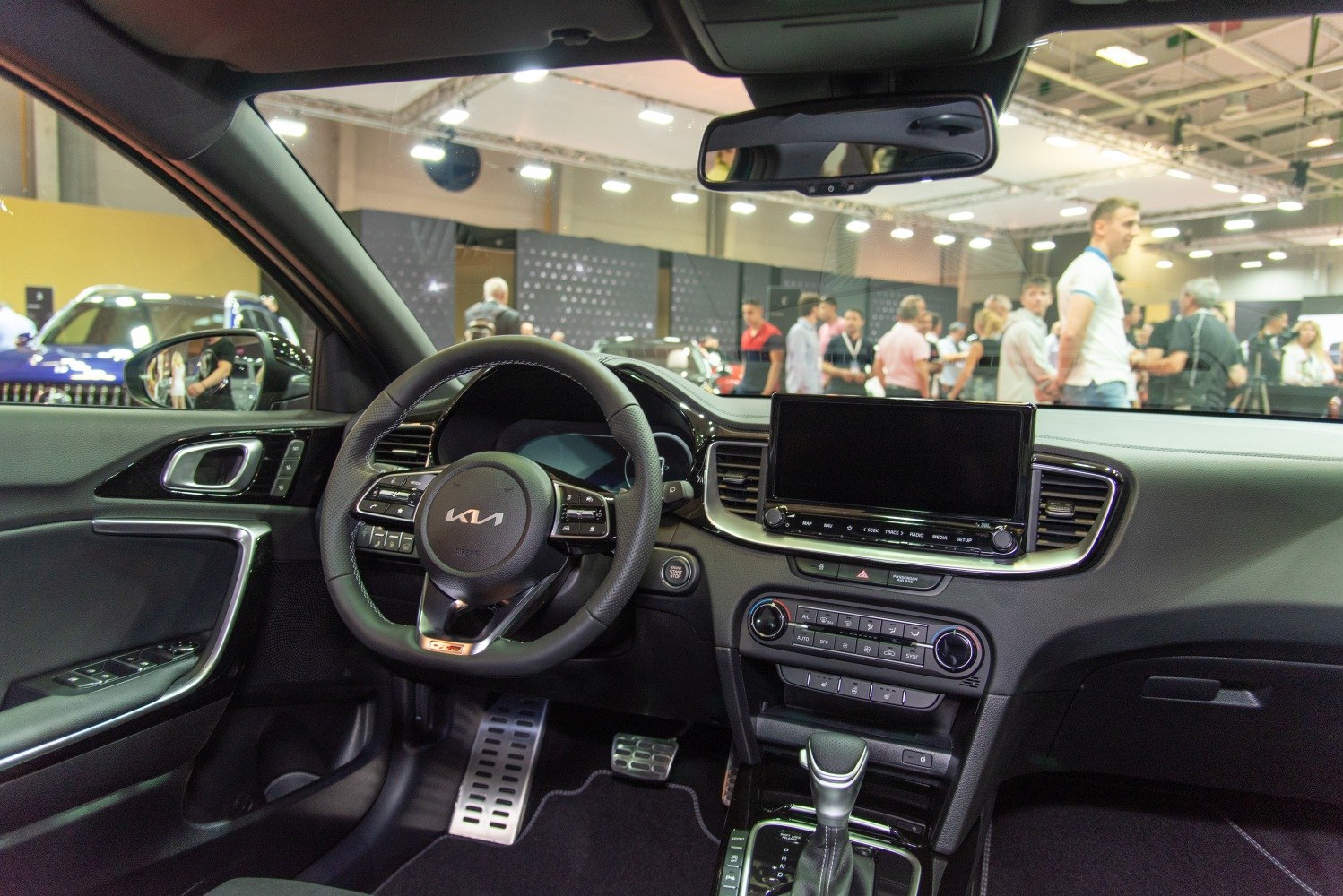 Modern car interior with digital display and multifunction steering wheel