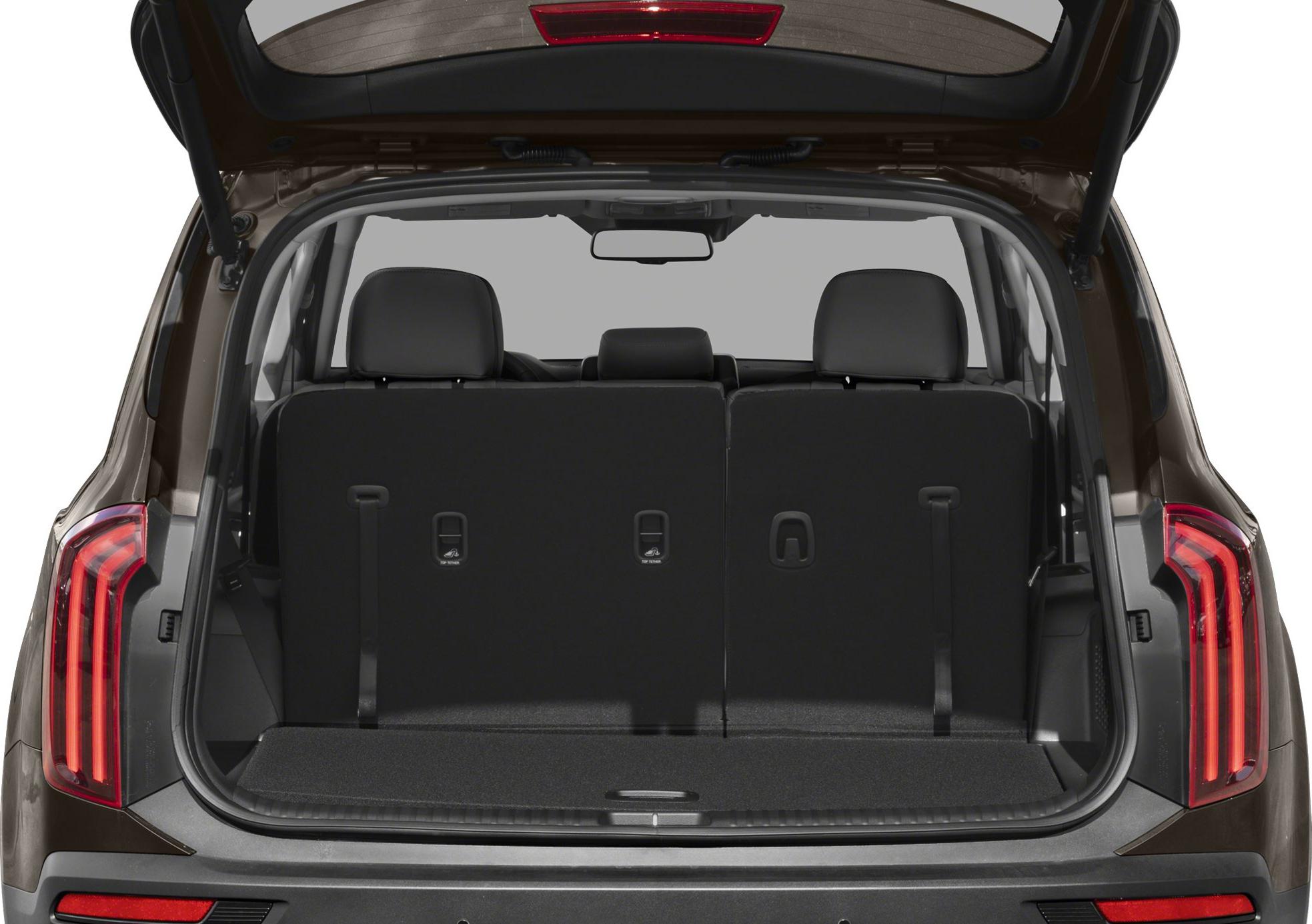 Rear cargo area with open tailgate and visible third-row seats.
