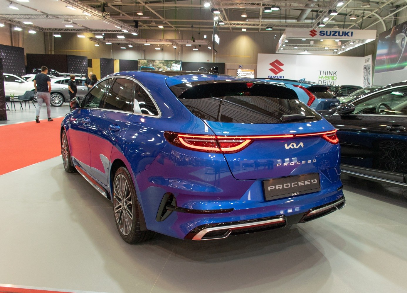 Rear view of blue station wagon with LED tail lights and sporty bumper