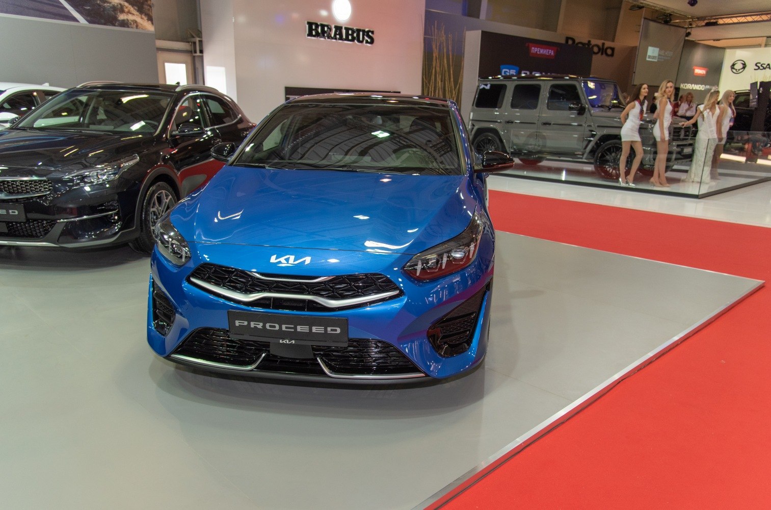 Aggressive grille and modern headlights on blue hatchback front