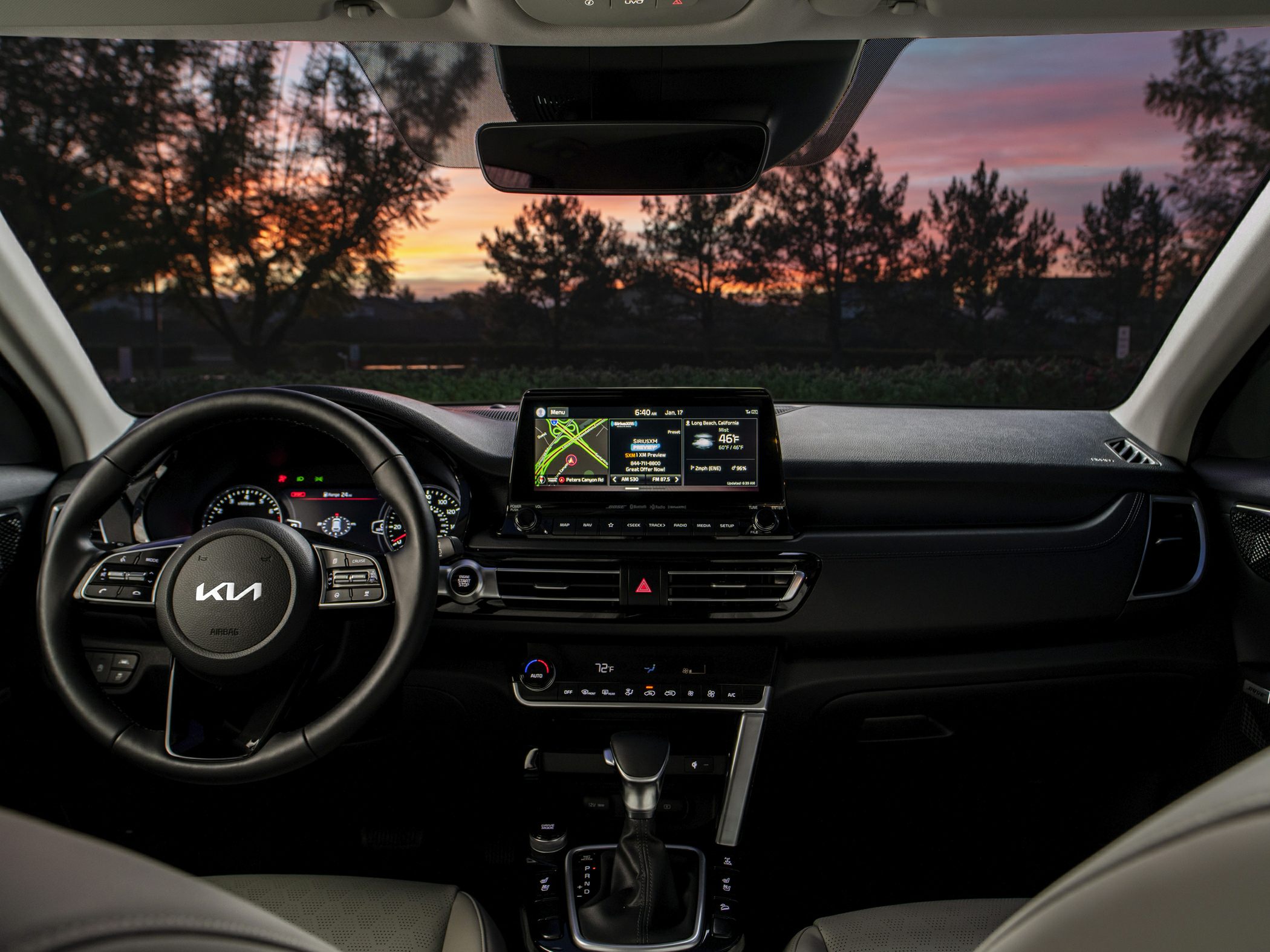 Digital dashboard, touchscreen infotainment, steering wheel controls, automatic gear shift