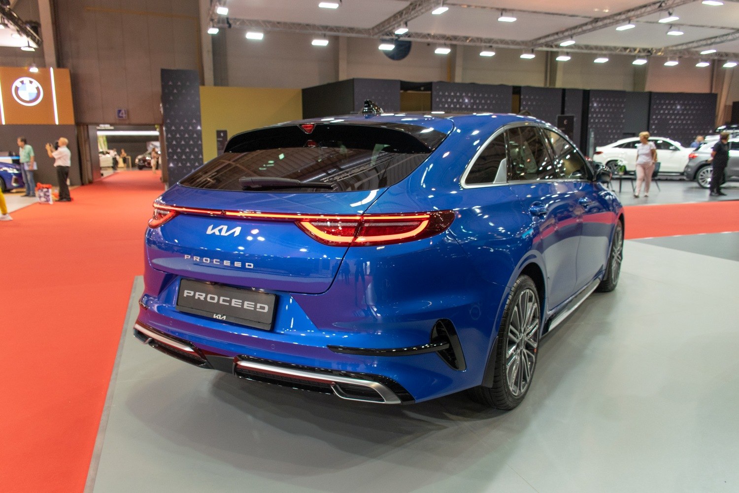 Rear view of a blue hatchback with sleek LED tail lights and sporty bumper.
