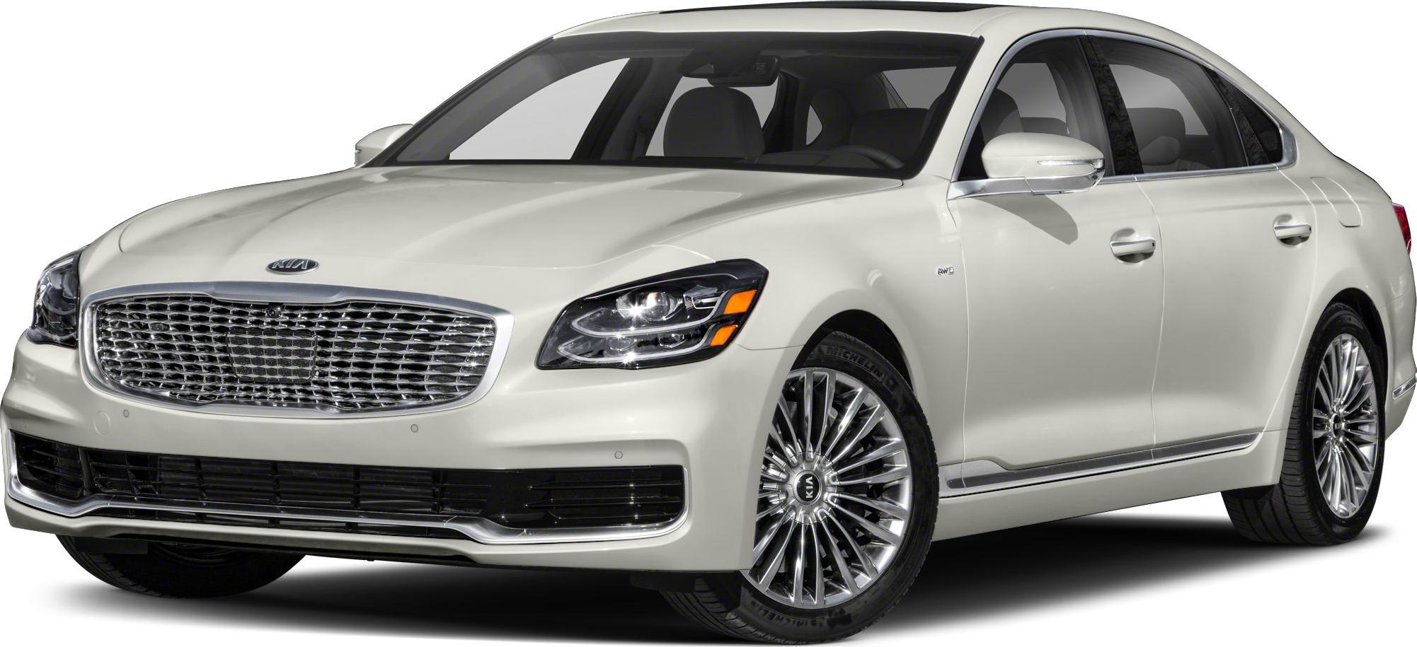 Luxury sedan front three-quarter view with chrome grille and alloy wheels