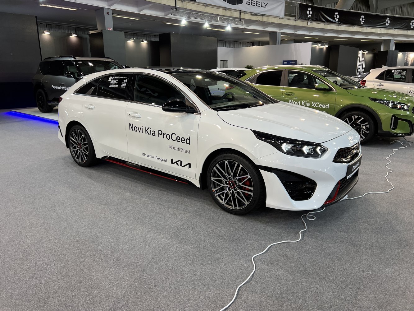 Sporty white hatchback with aerodynamic lines and dynamic multi-spoke wheels