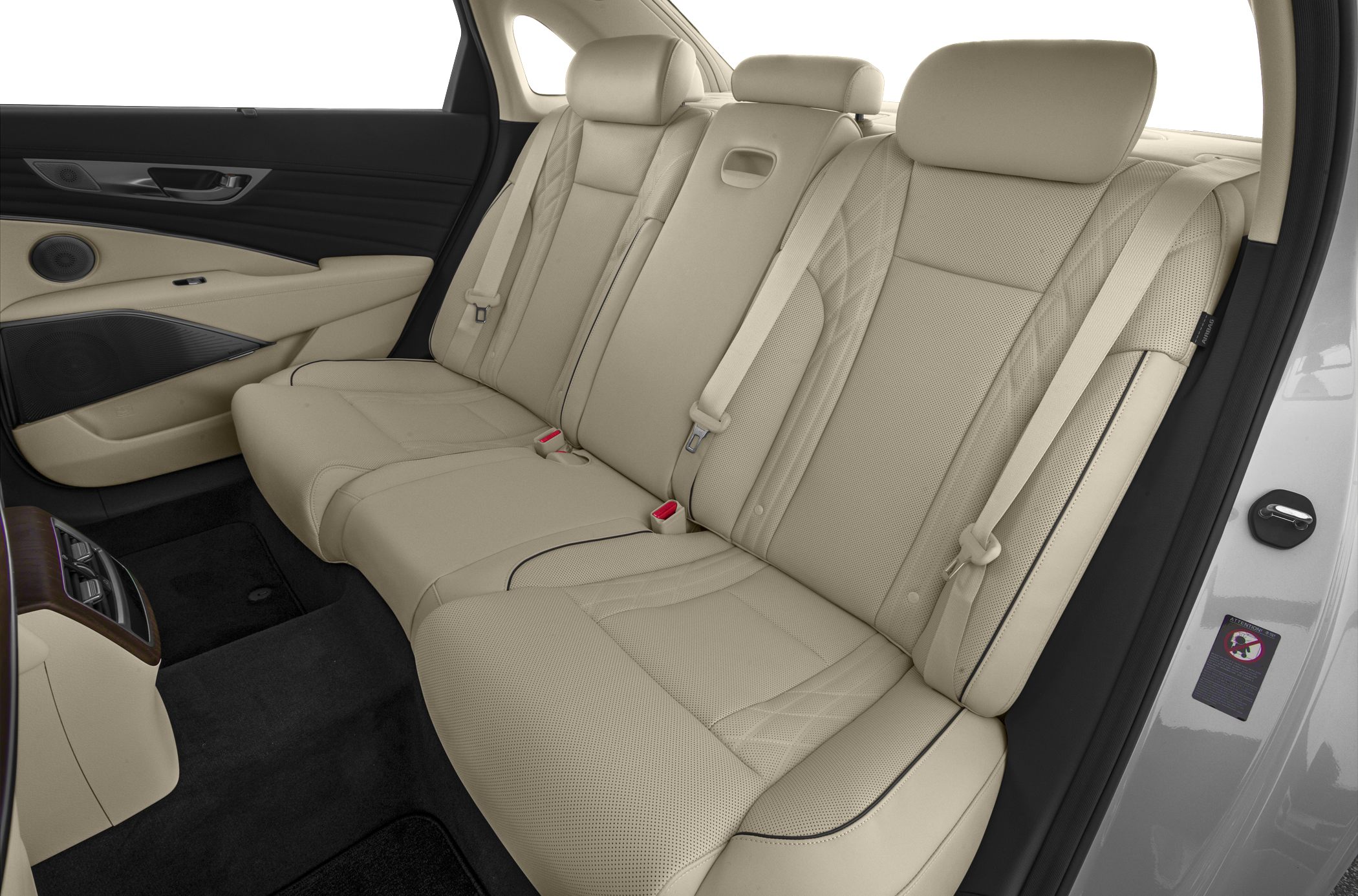 Beige perforated leather rear seats with stitching and rear cabin controls