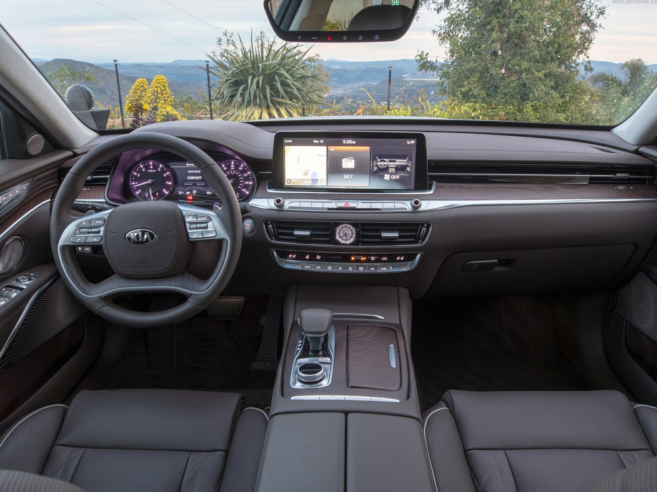Digital dashboard and infotainment screen in luxury vehicle interior