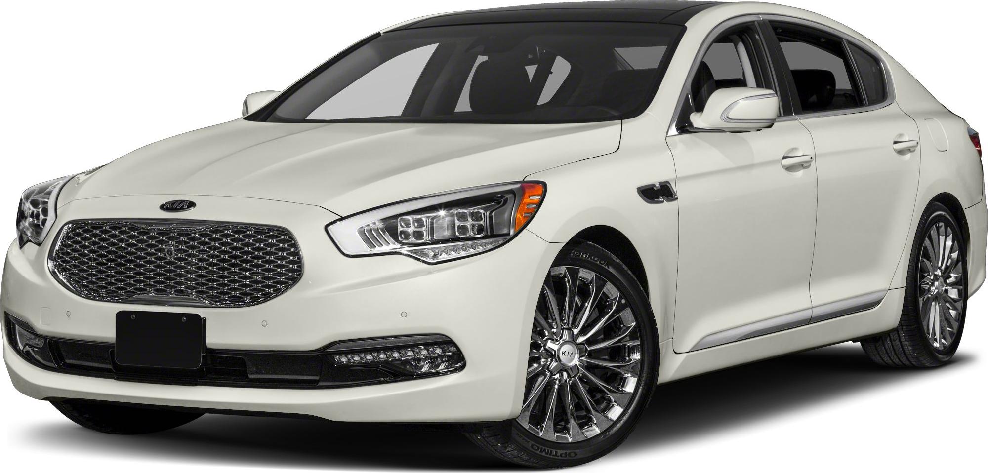 Luxury sedan front angle with LED headlights and mesh grille.