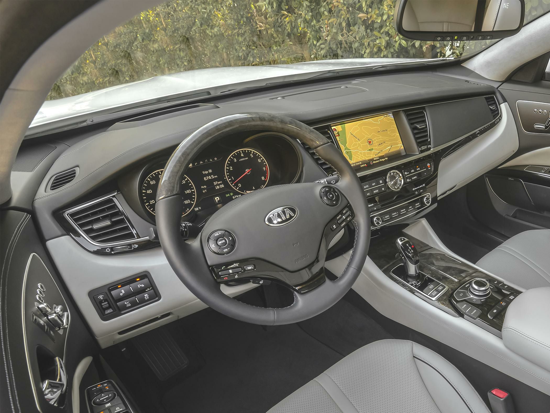 Luxury car interior with dashboard and multifunction steering wheel