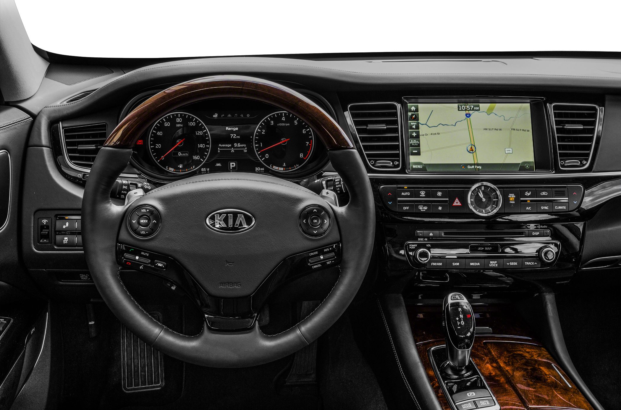 Steering wheel, dashboard instrument cluster, infotainment screen, wood trim center console