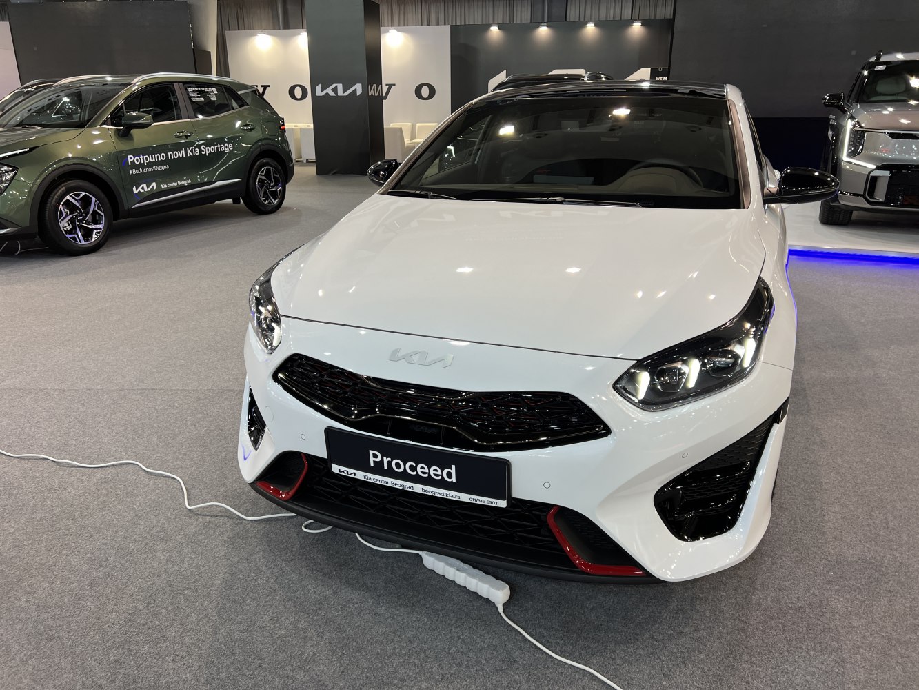Sporty front grille and modern LED headlights of a white car