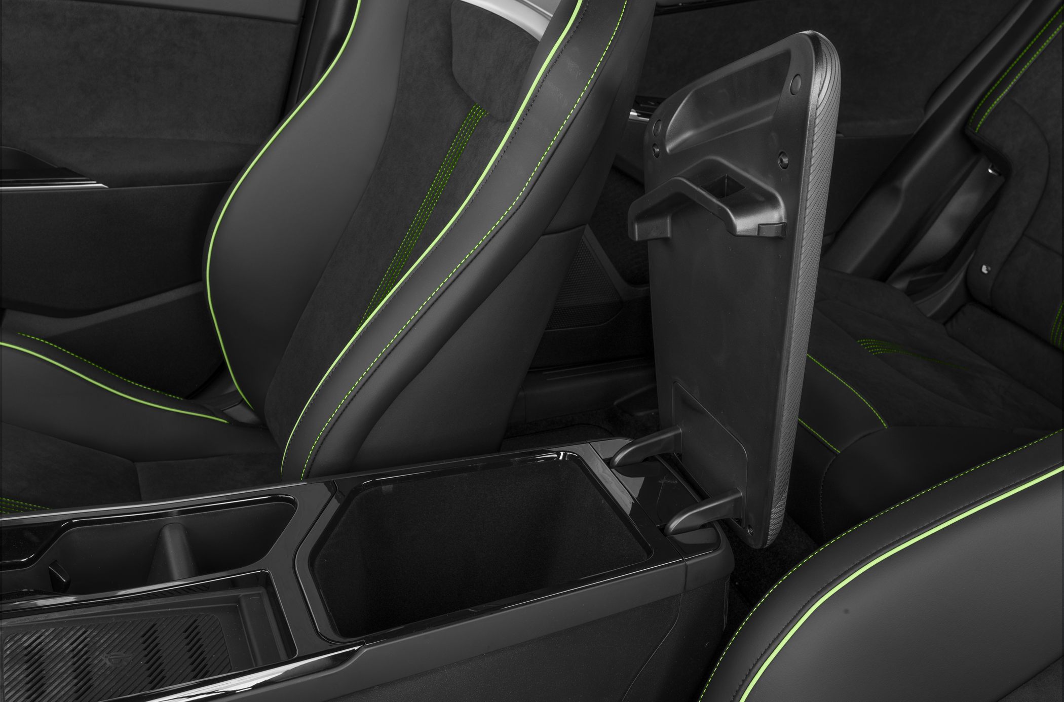 Sporty seats with green stitching and open center console storage