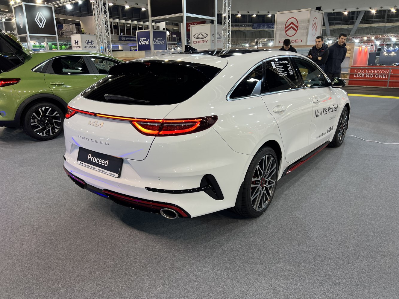 White hatchback rear with LED light bar and sporty dual exhaust design