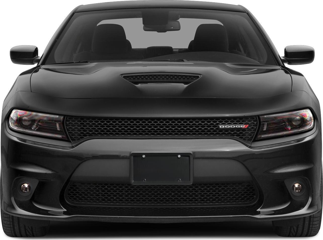 Front grille, hood scoop, and headlights of a muscle car