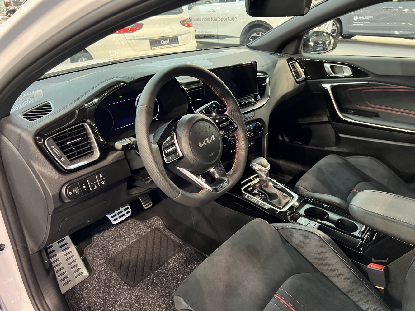 Modern car interior with digital dashboard and sporty steering wheel