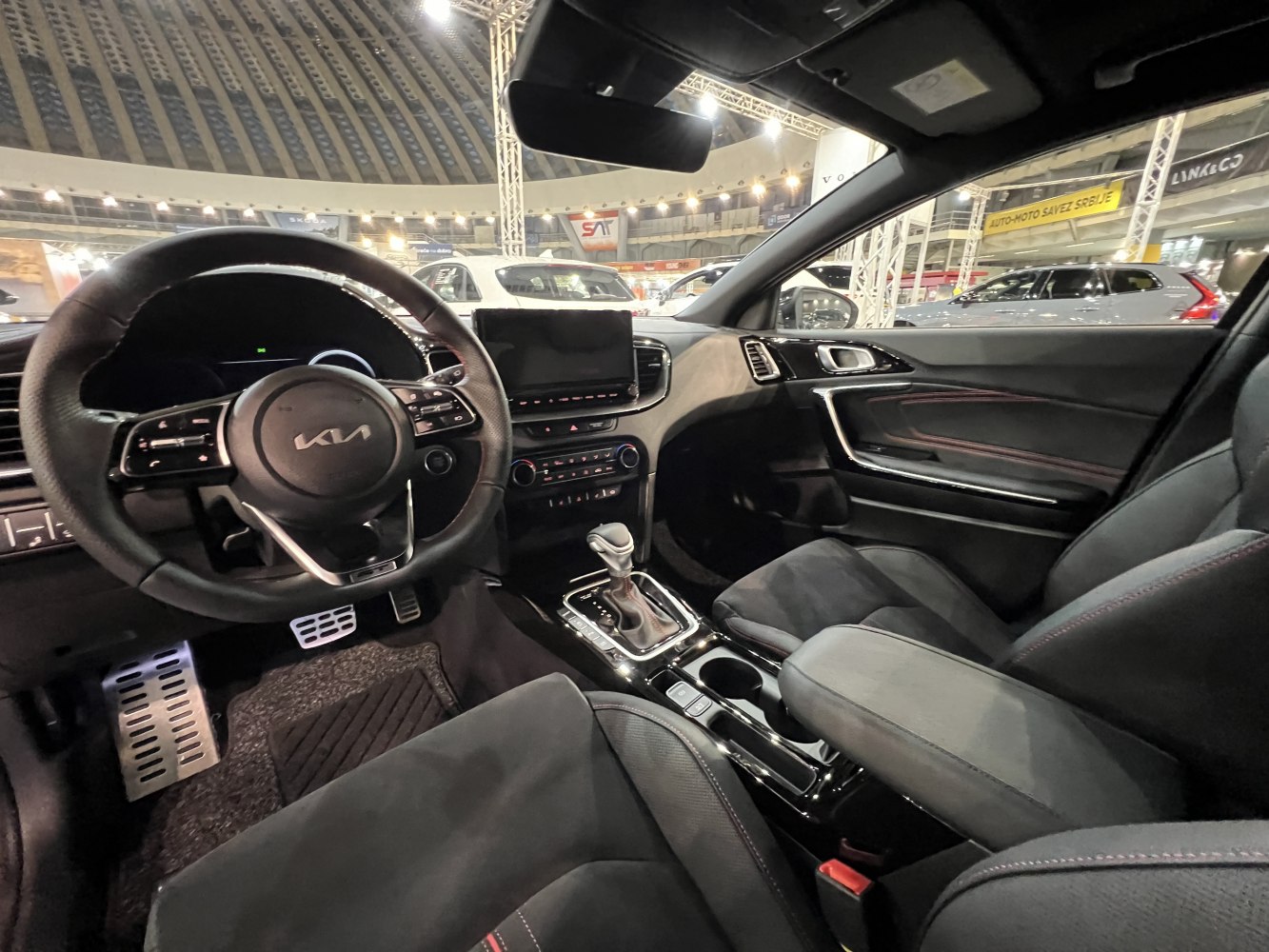 Modern dashboard with multifunction steering wheel and automatic gear shifter