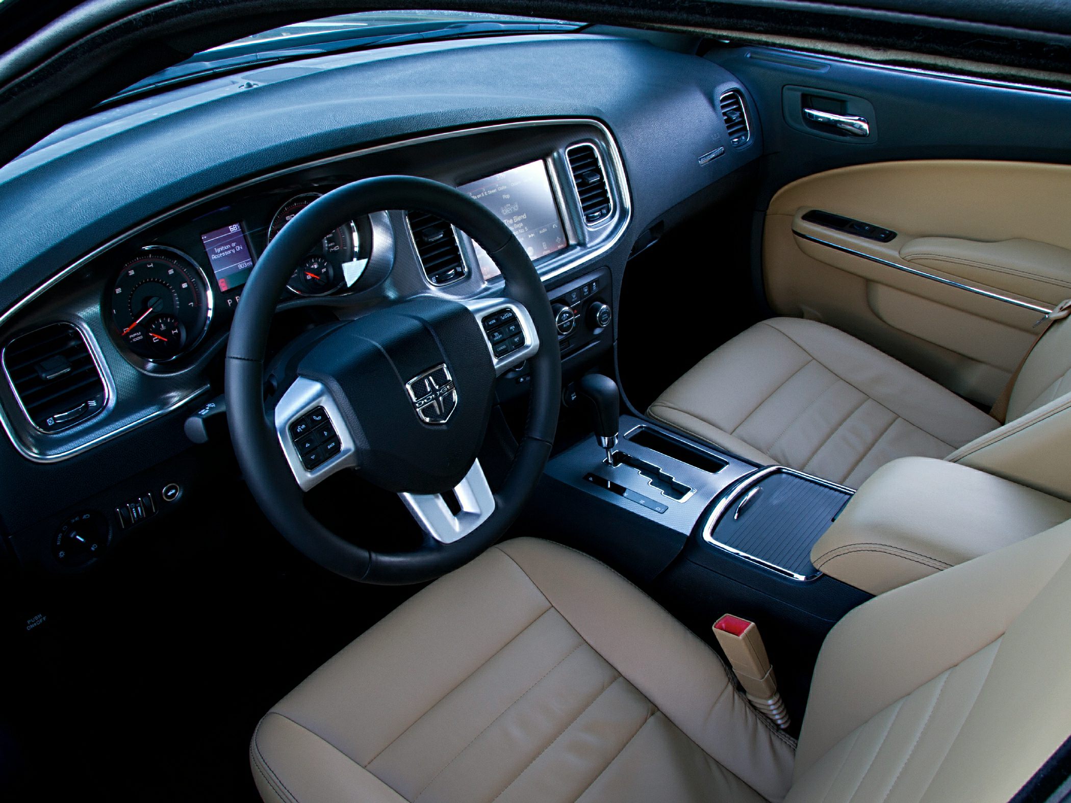 Beige leather seats with modern dashboard and steering wheel controls