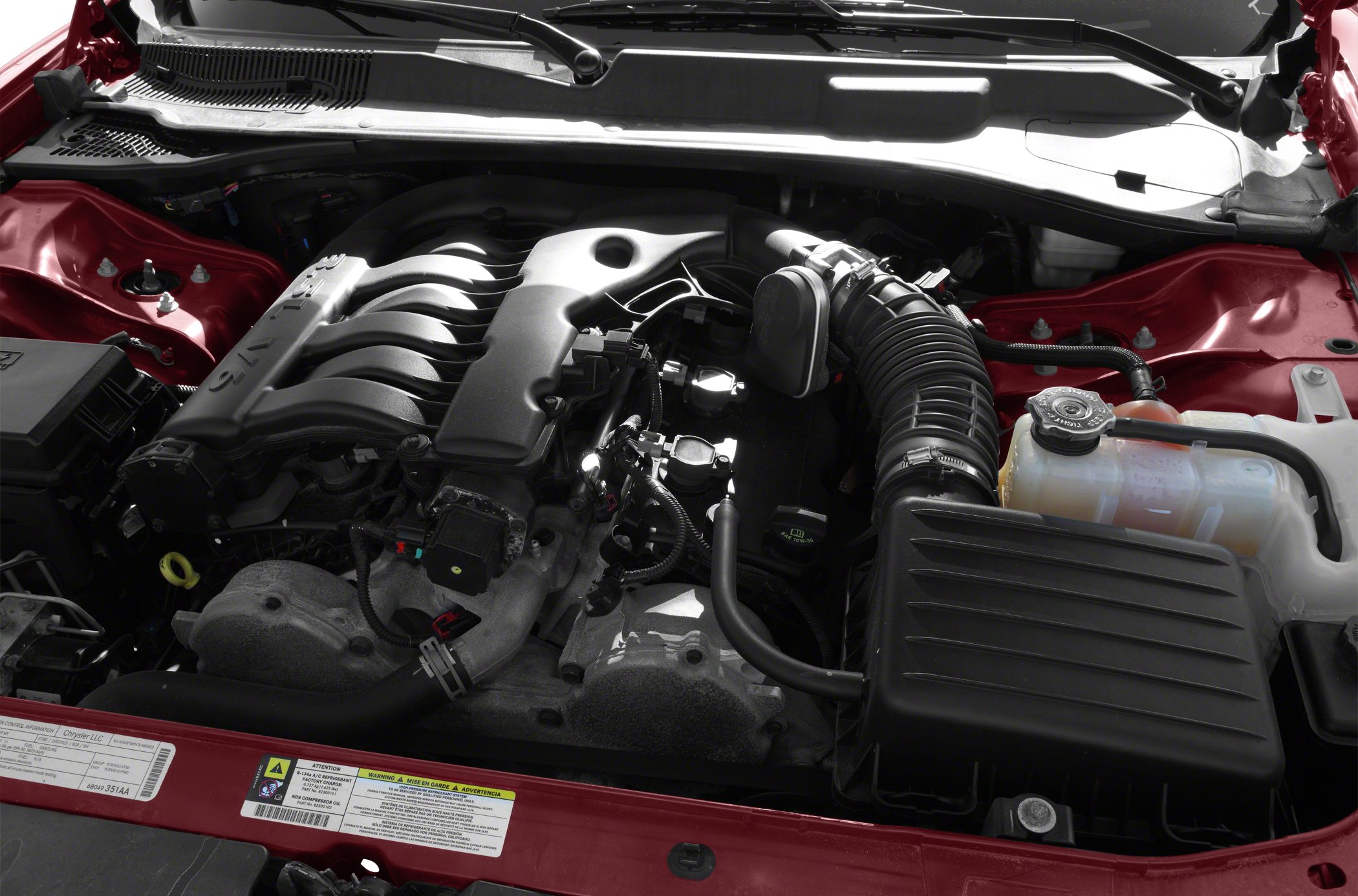 V6 engine with air intake and fluid reservoir in engine bay