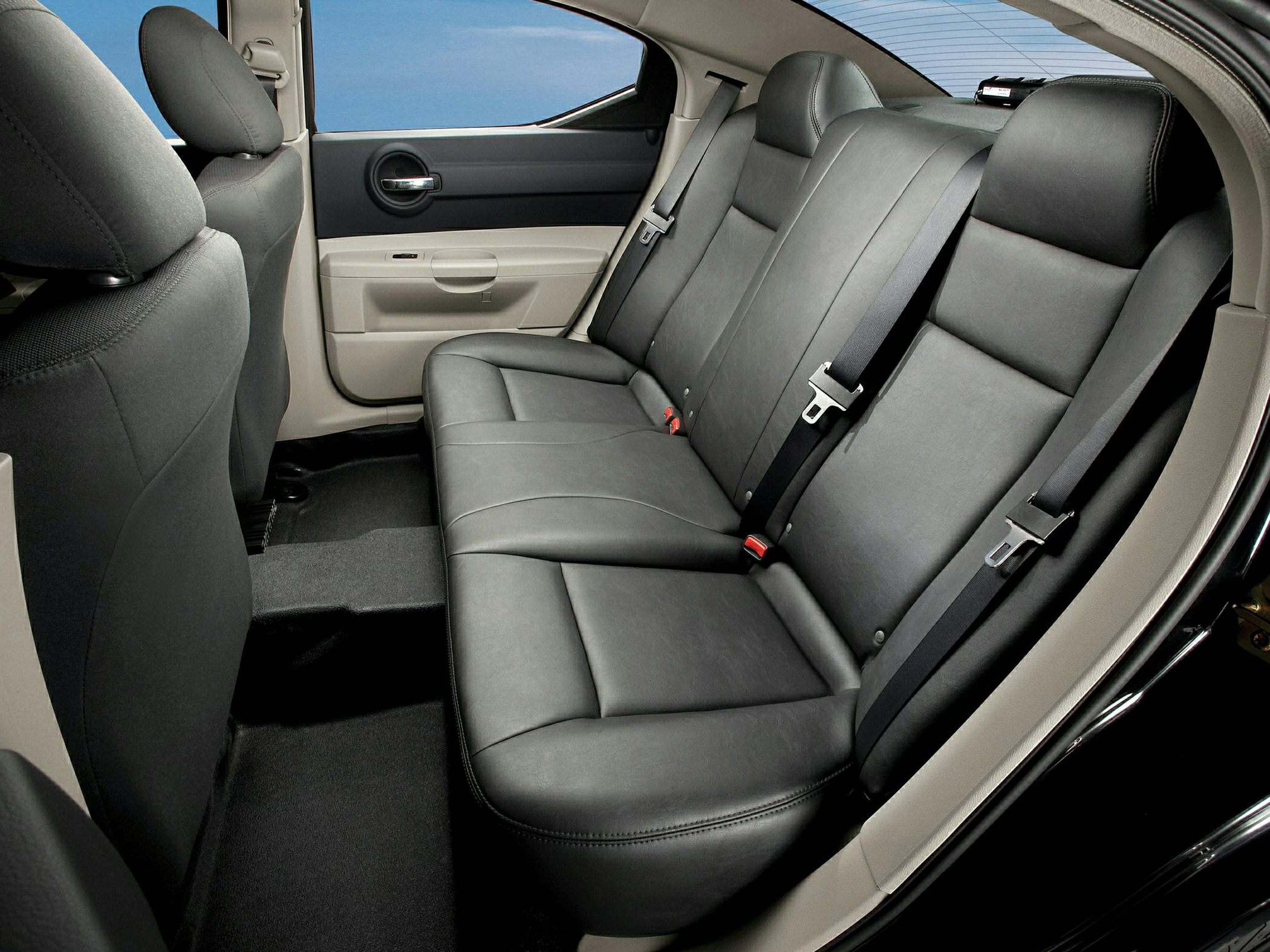 Rear black leather seats with seat belts and door panel
