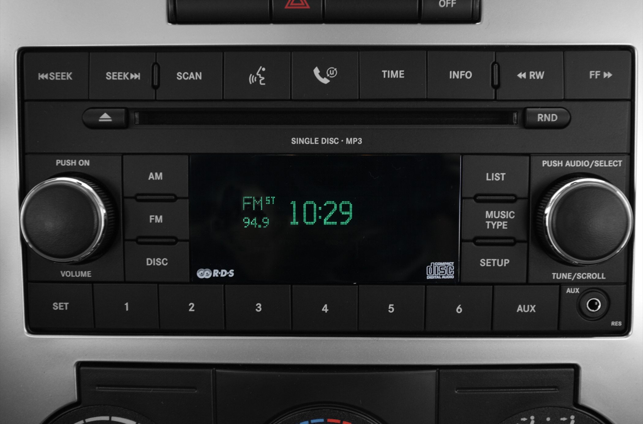 Radio and audio control panel with volume and tuning knobs