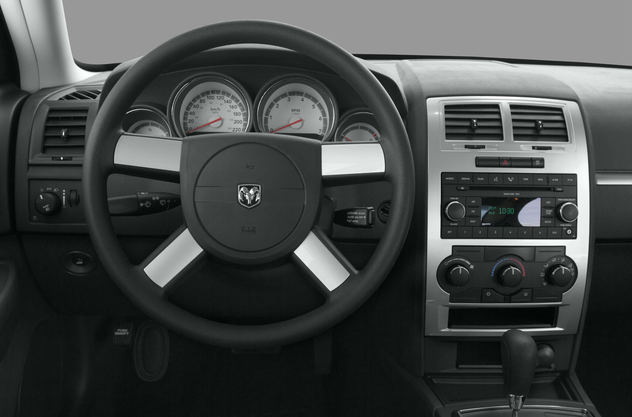 Steering wheel with instrument cluster and center console controls
