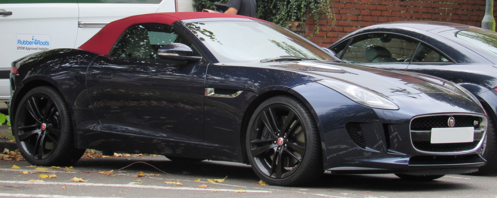 Convertible with red soft top and black alloy wheels