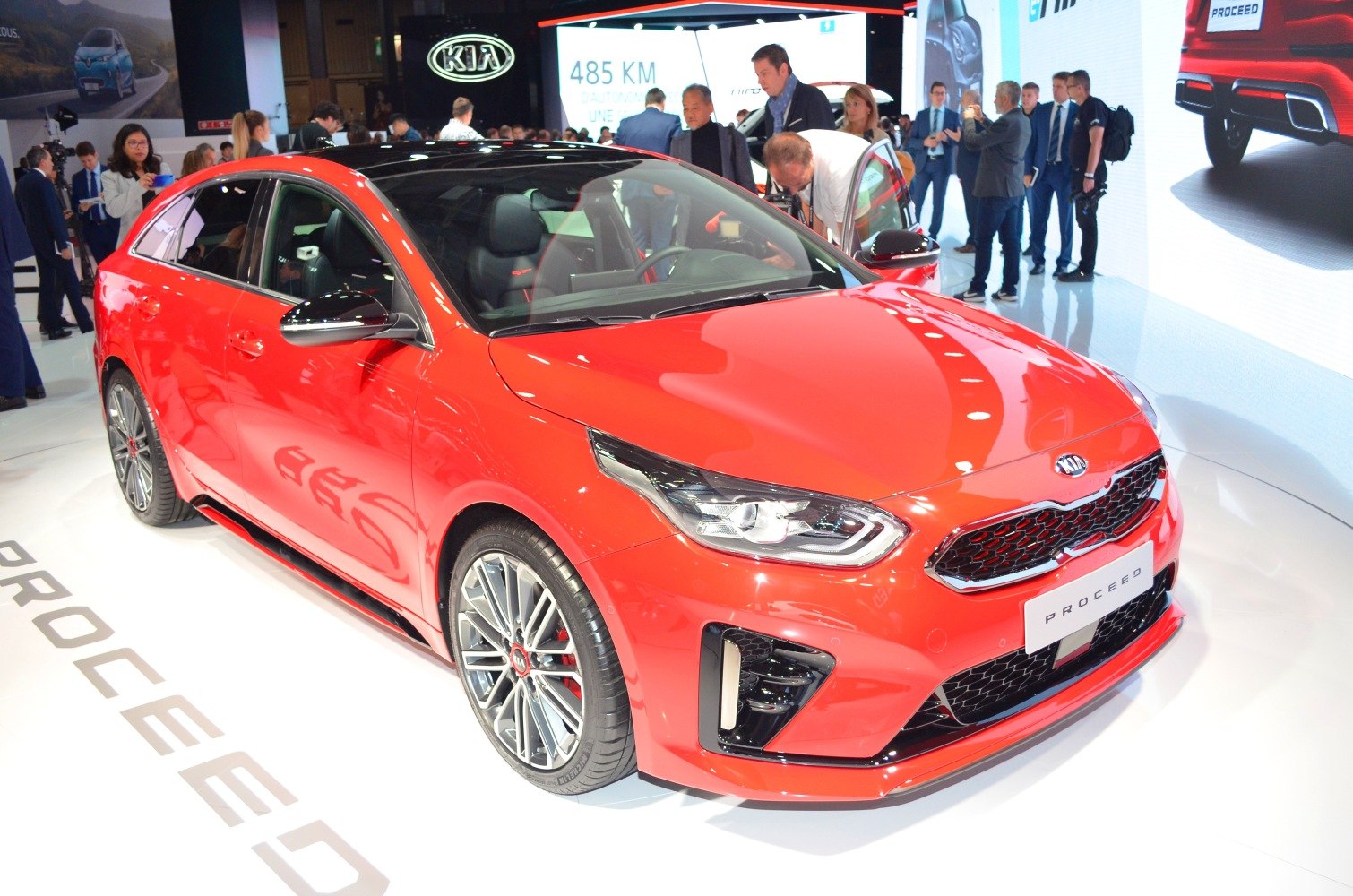 Sporty red hatchback with LED headlights and aggressive front grille