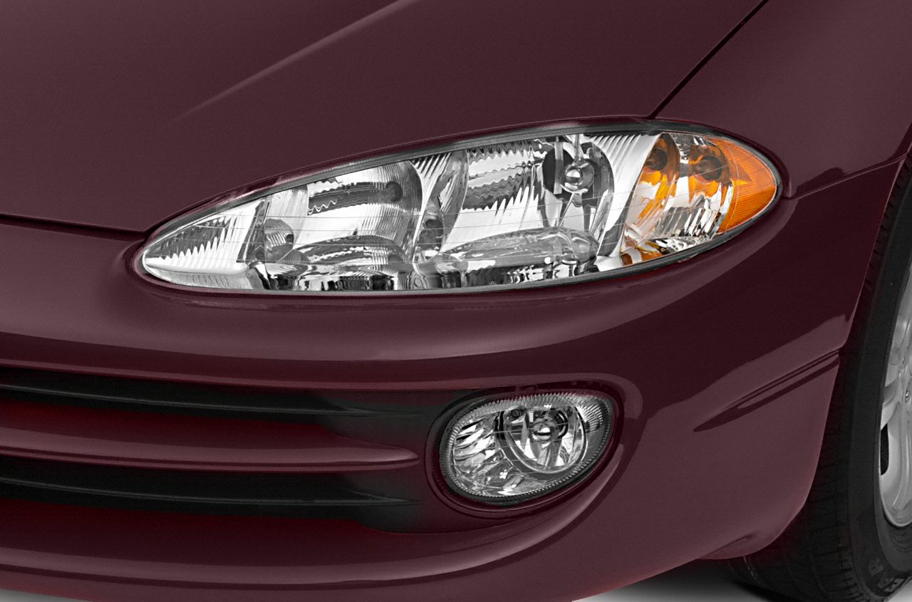 Front headlight and fog light assembly with clear lens and amber turn signal