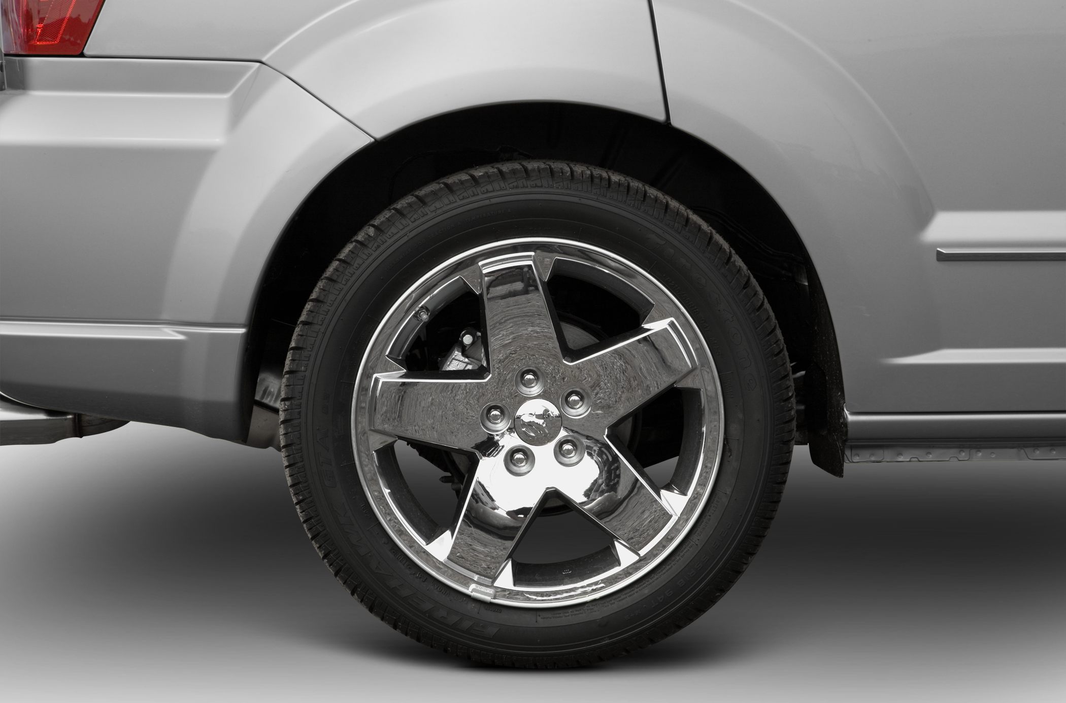 Chrome 5-spoke alloy wheel and tire detail