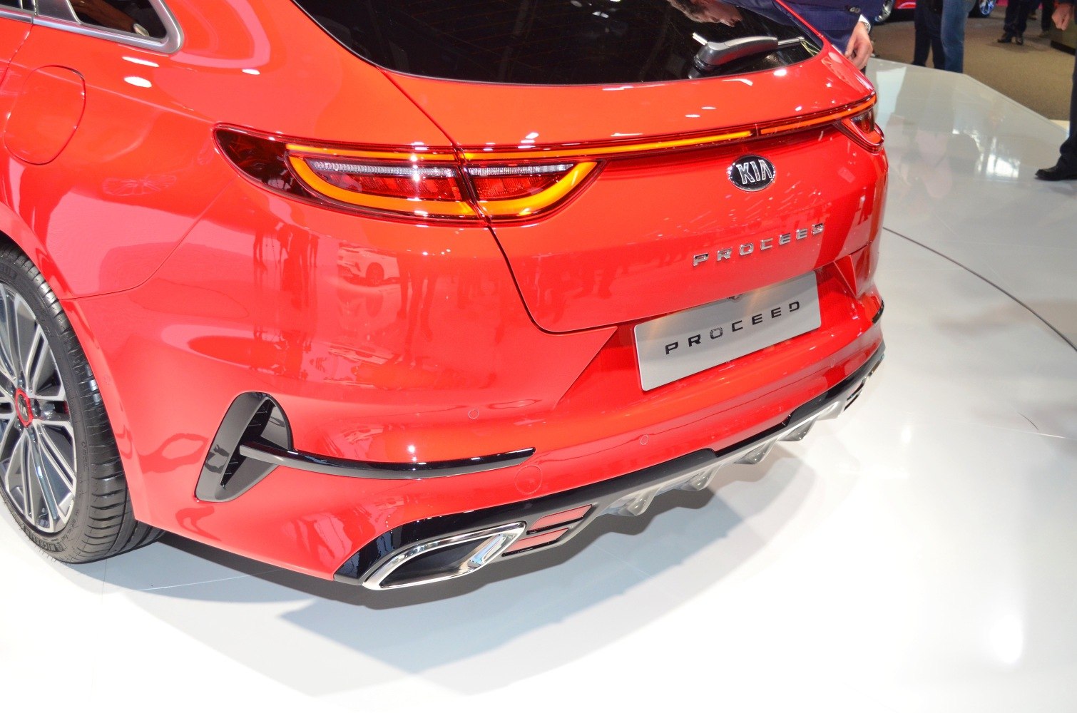 Close-up of rear tail lights and exhausts on a sporty hatchback.