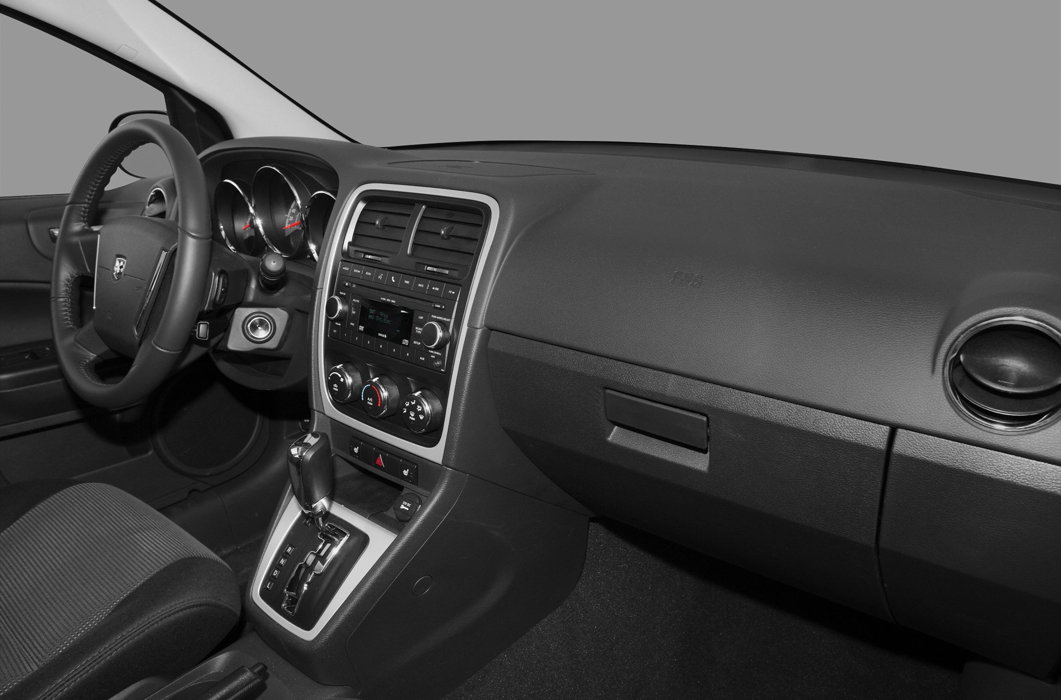 Dashboard, center console, steering wheel, gear shift