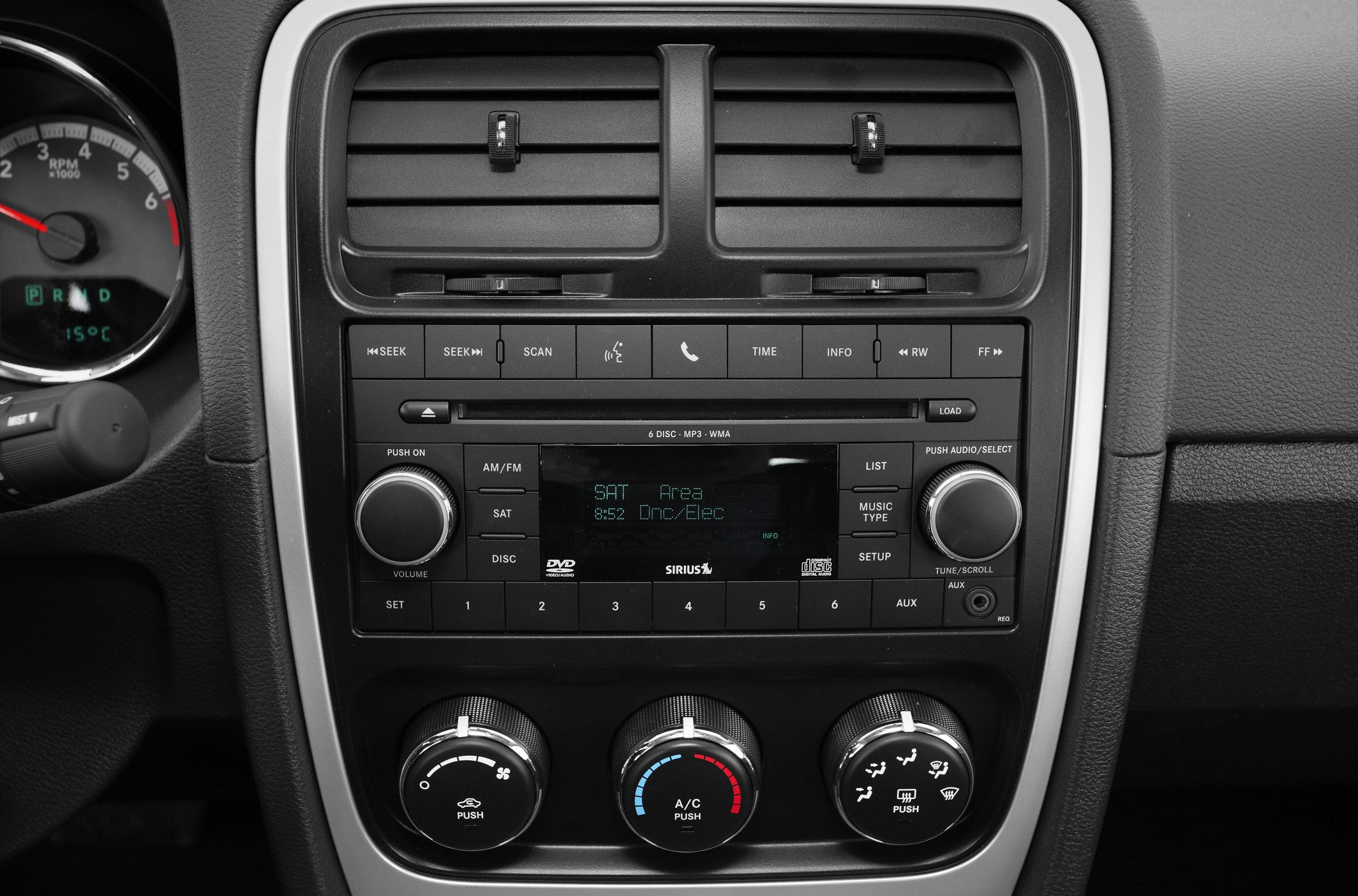 Central audio system and climate control panel with knobs and buttons