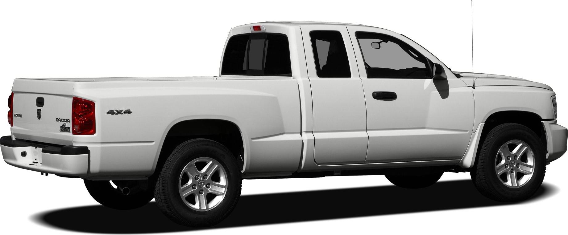 White extended cab pickup truck rear side view with 4x4 and alloy wheels