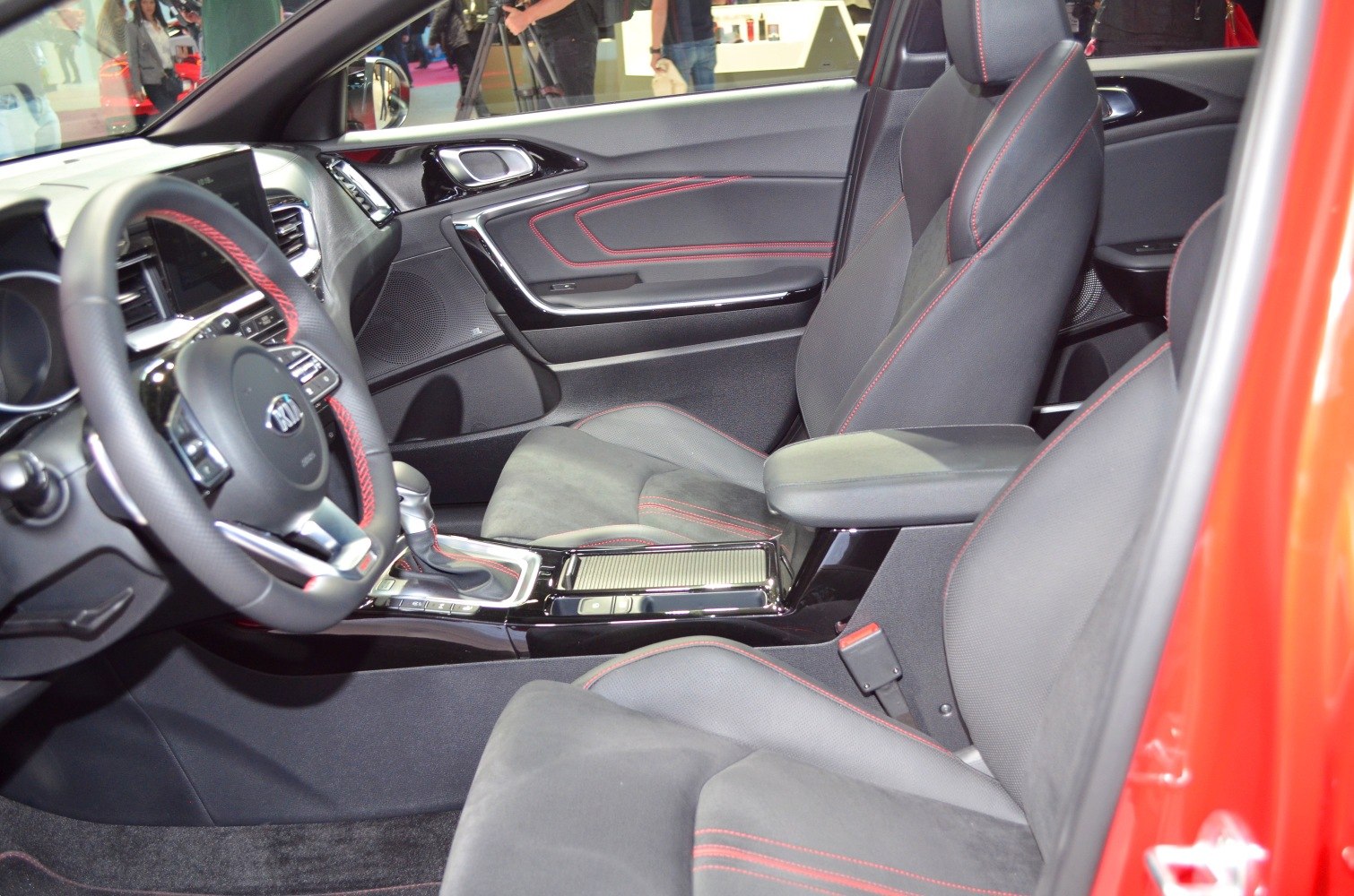 Sporty car interior with red stitching and modern dashboard design