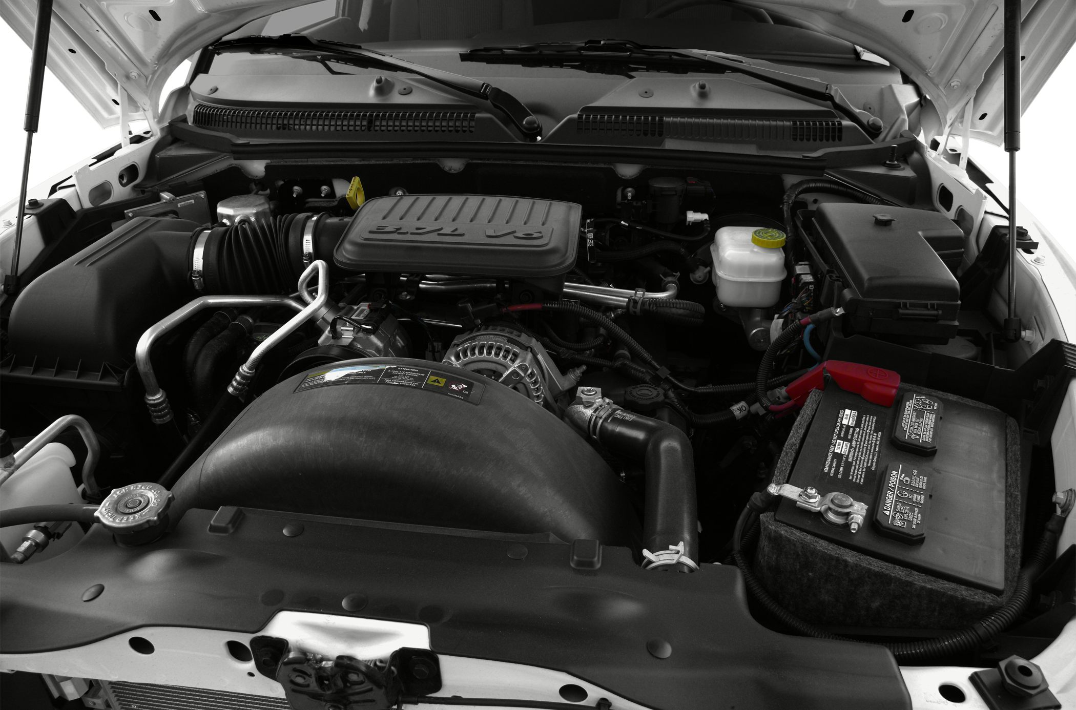 3.7L V6 engine bay with components and battery visible