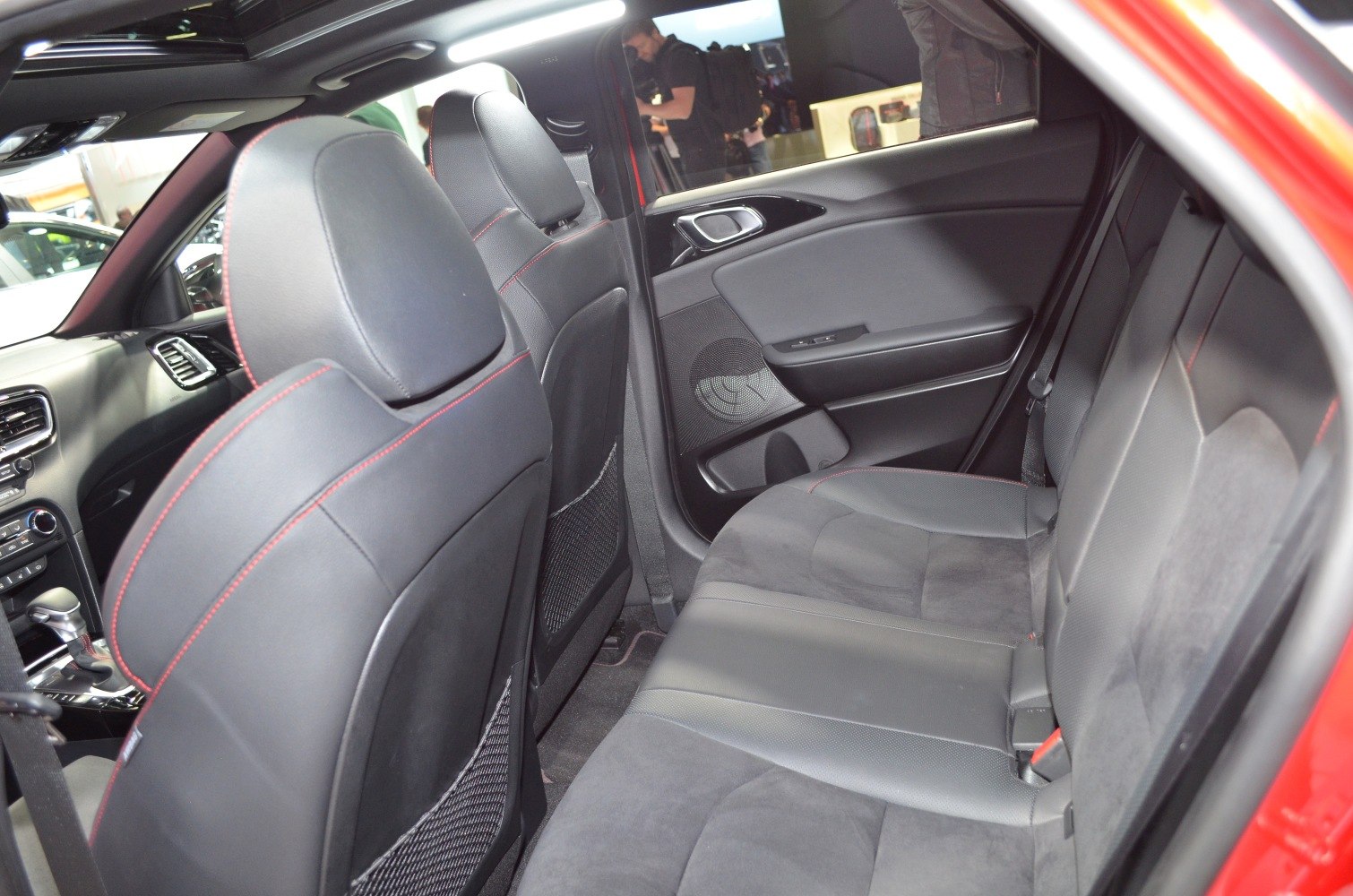 Rear seats with leather upholstery and red stitching