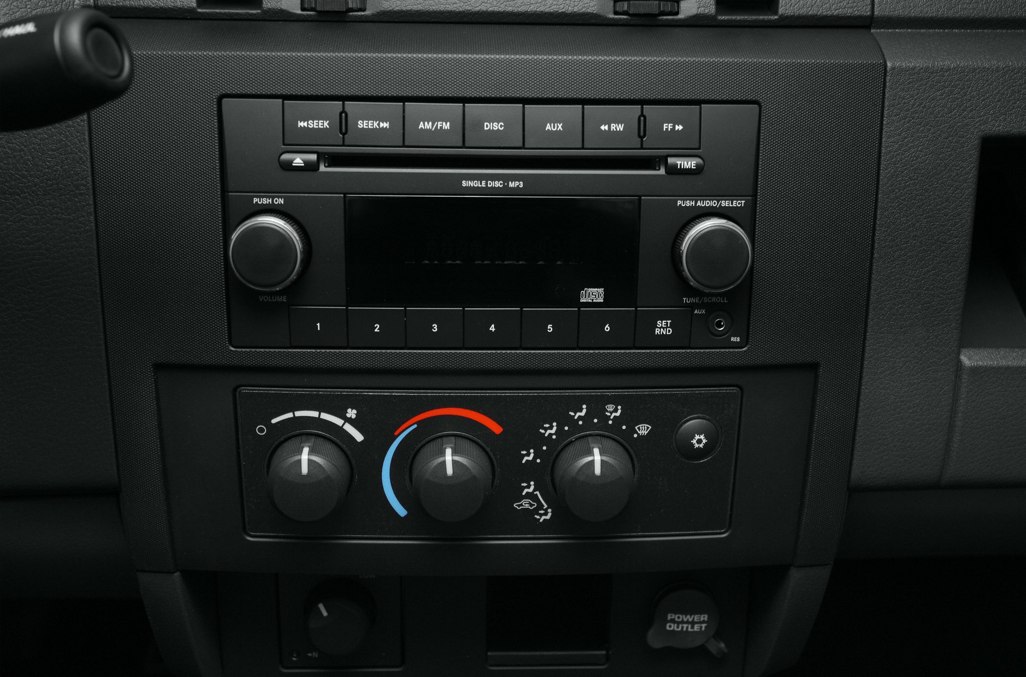 Radio unit and HVAC control knobs with volume, tuning, temperature, and airflow settings