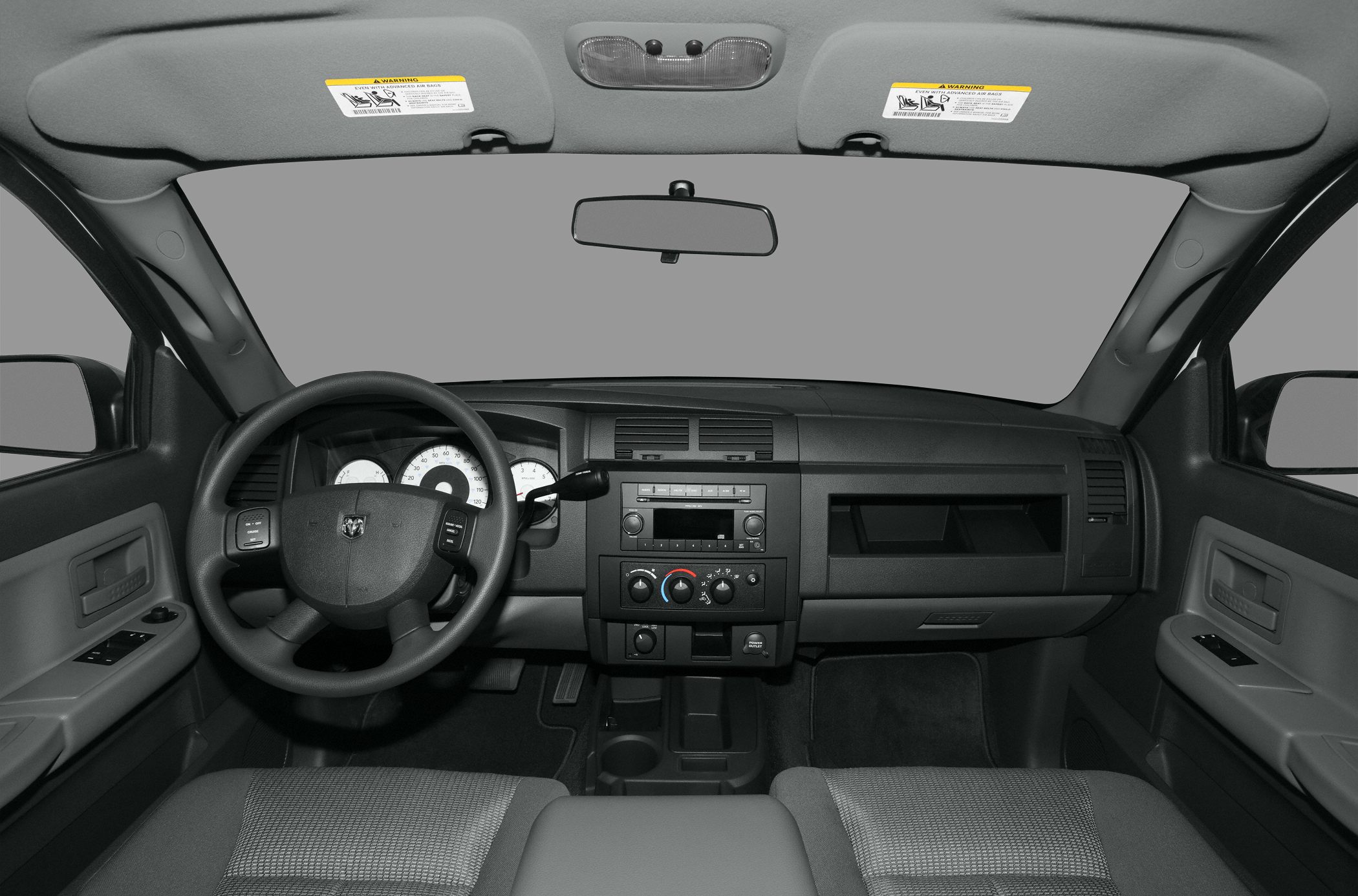 Dashboard, steering wheel, center console controls of a truck interior