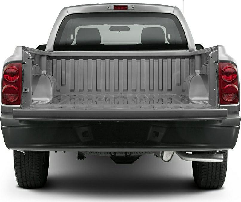 Open truck bed with tailgate down and rear lights visible