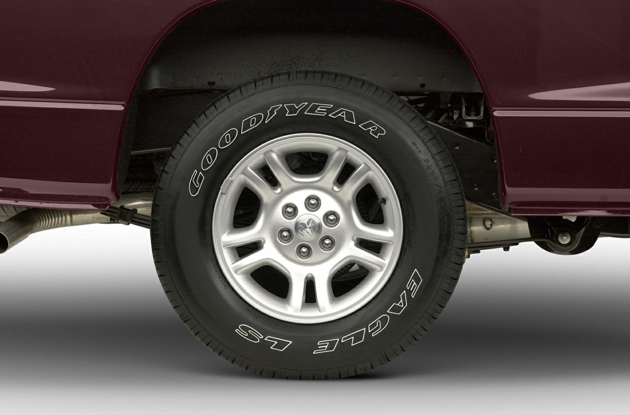 Alloy wheel with Goodyear Eagle LS tire and visible suspension parts