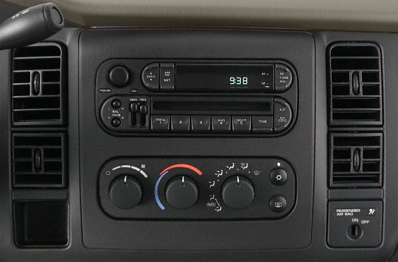 Classic dashboard radio and climate controls with vents and passenger airbag switch