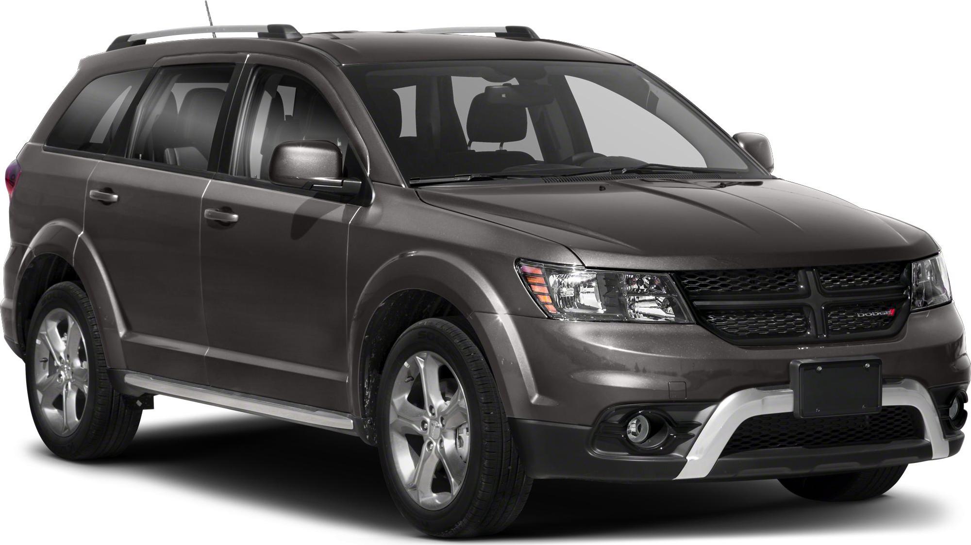 Front-side view of SUV with roof rails and fog lights