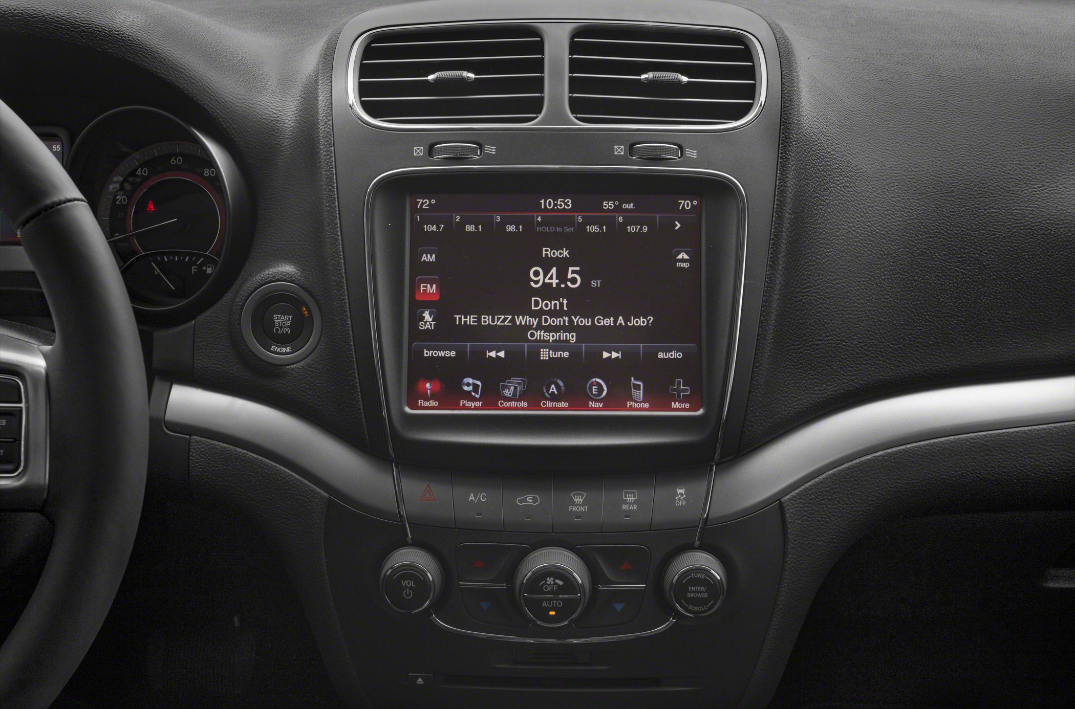 Central touchscreen infotainment with climate control knobs and air vents