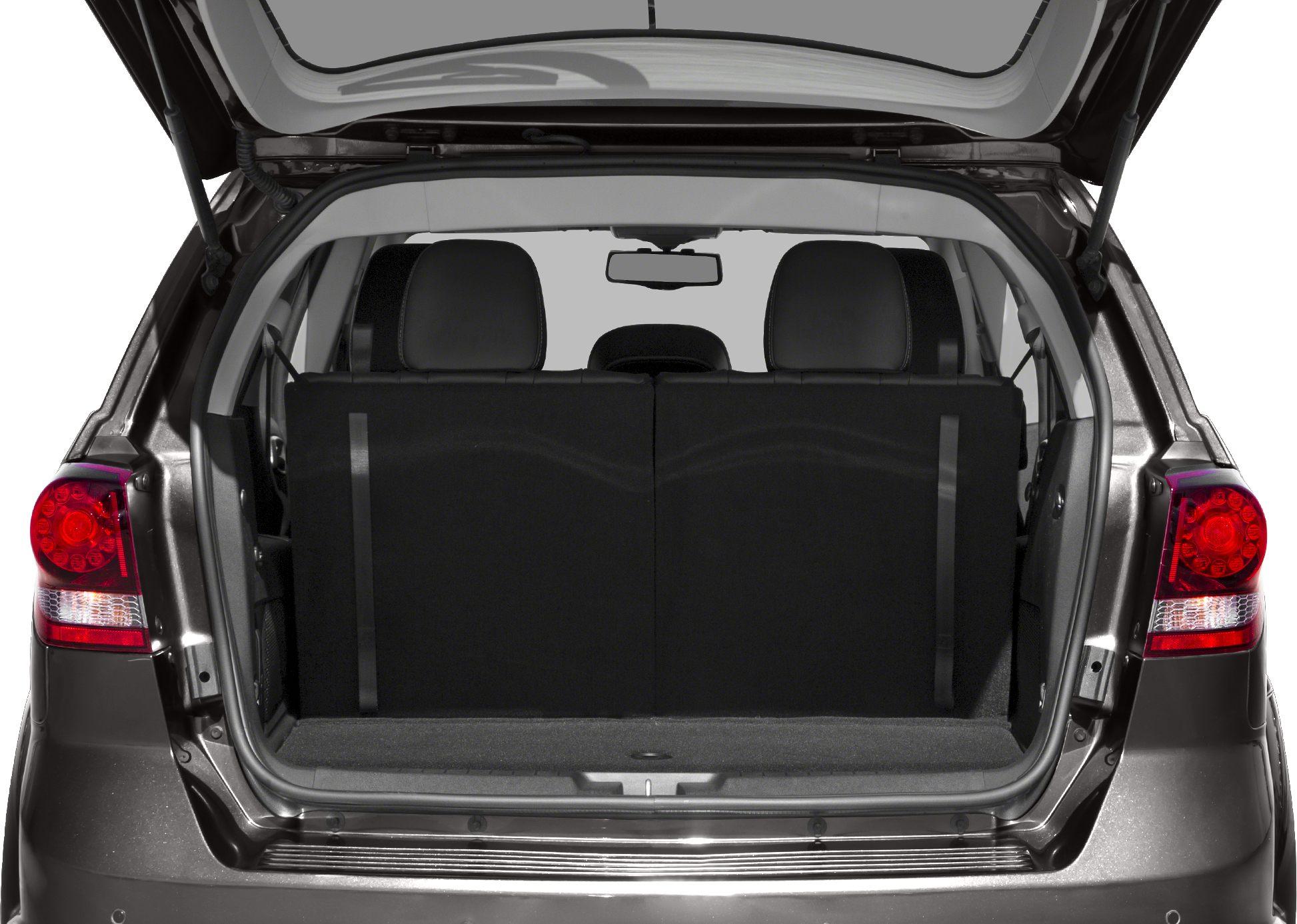 Open rear trunk with spacious cargo area and rear seats visible.