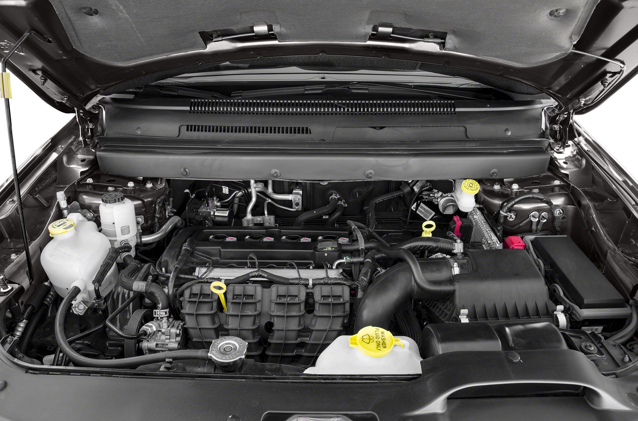 Engine bay with visible fluid reservoirs and engine components
