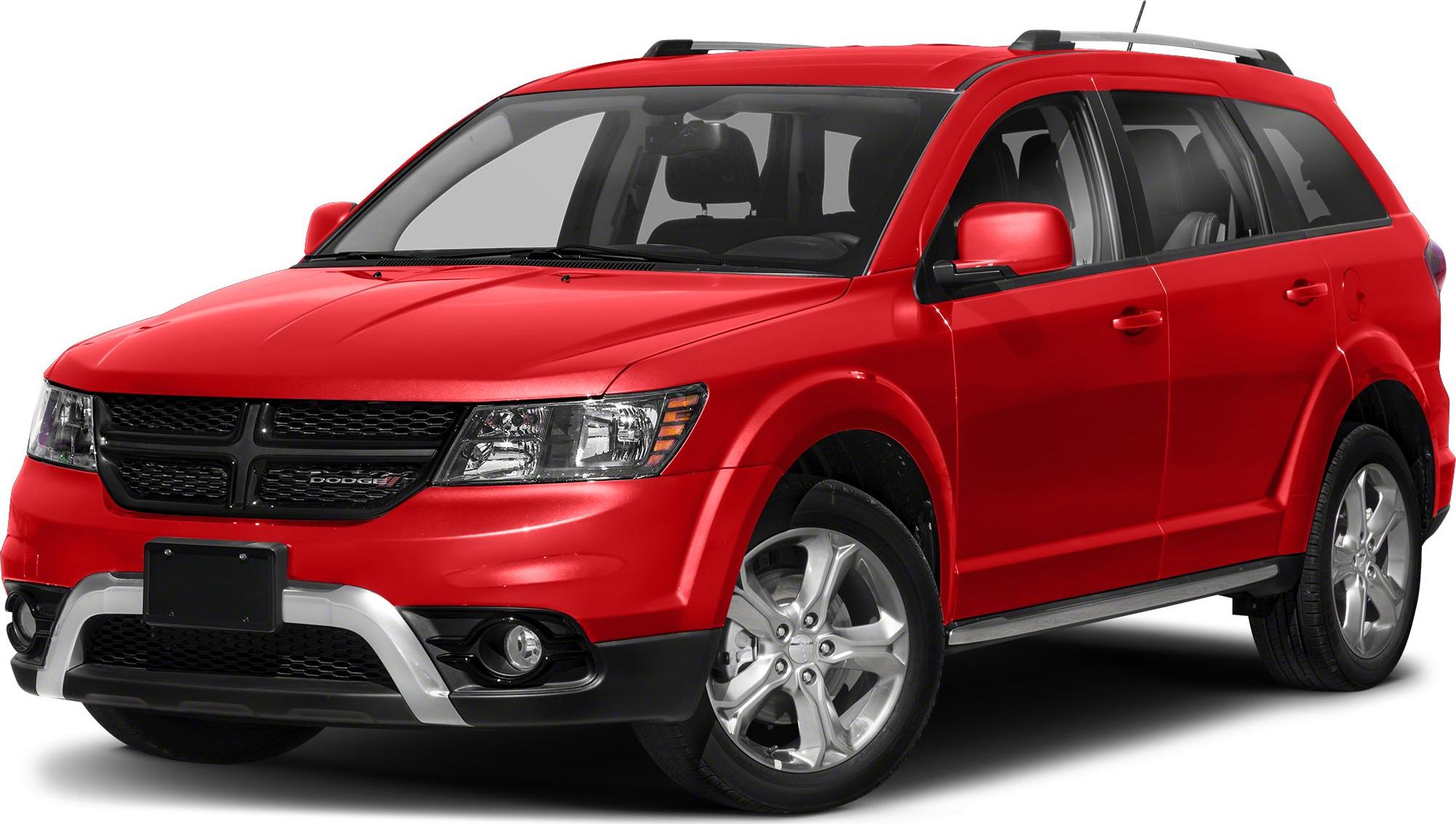 Front side view of red SUV with black grille and roof rails.