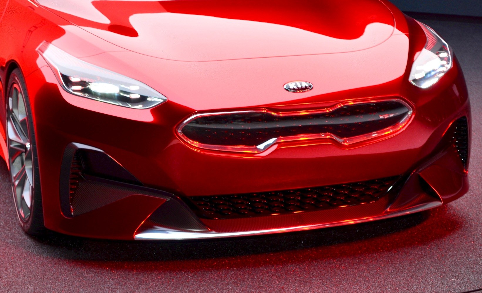 Close-up of front grille and LED headlights with sleek aerodynamic bumper